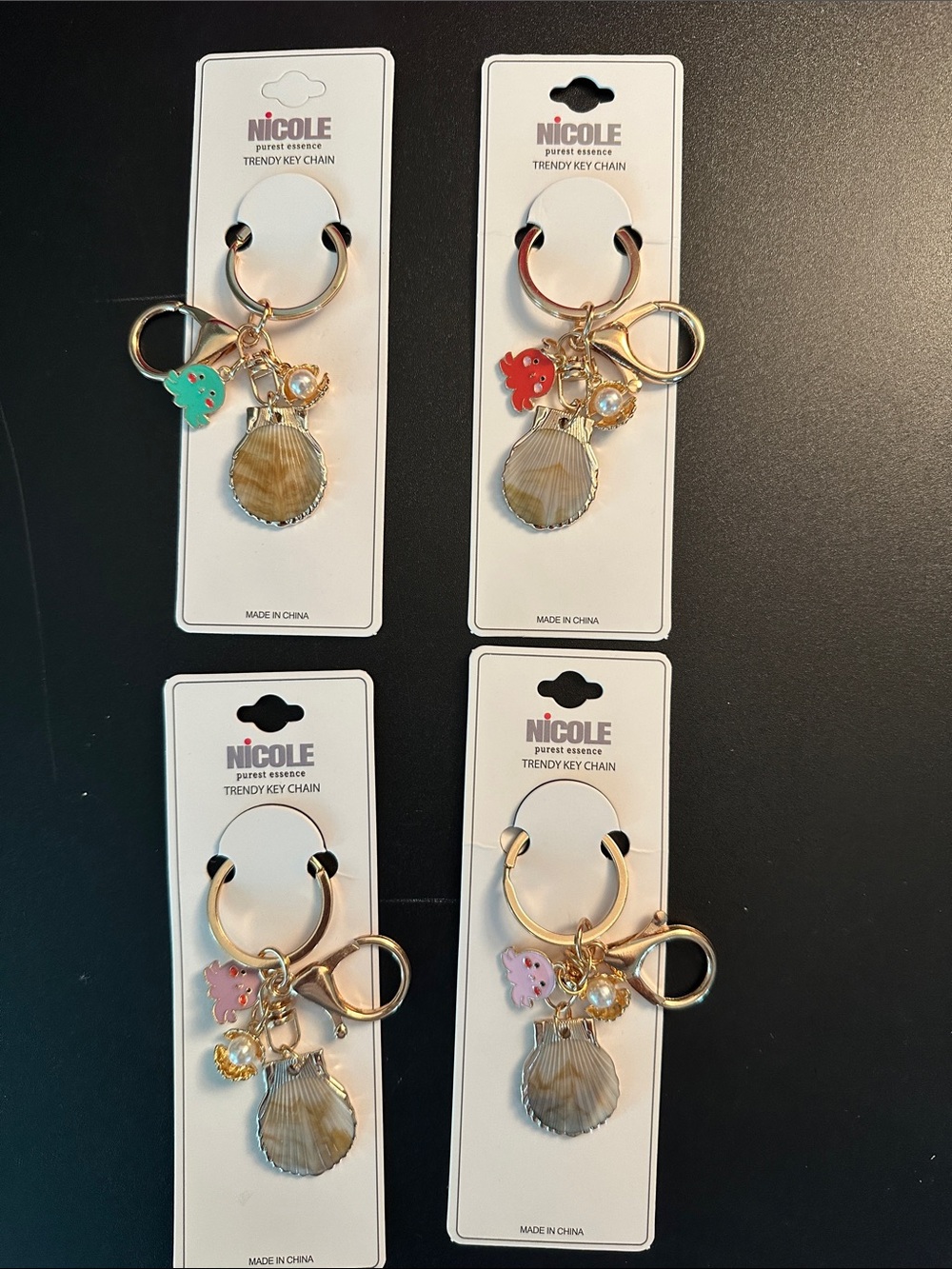 Set of 4 - Nicole Gold Shell Keychain with Pink, Red, Purple, and Green Charms